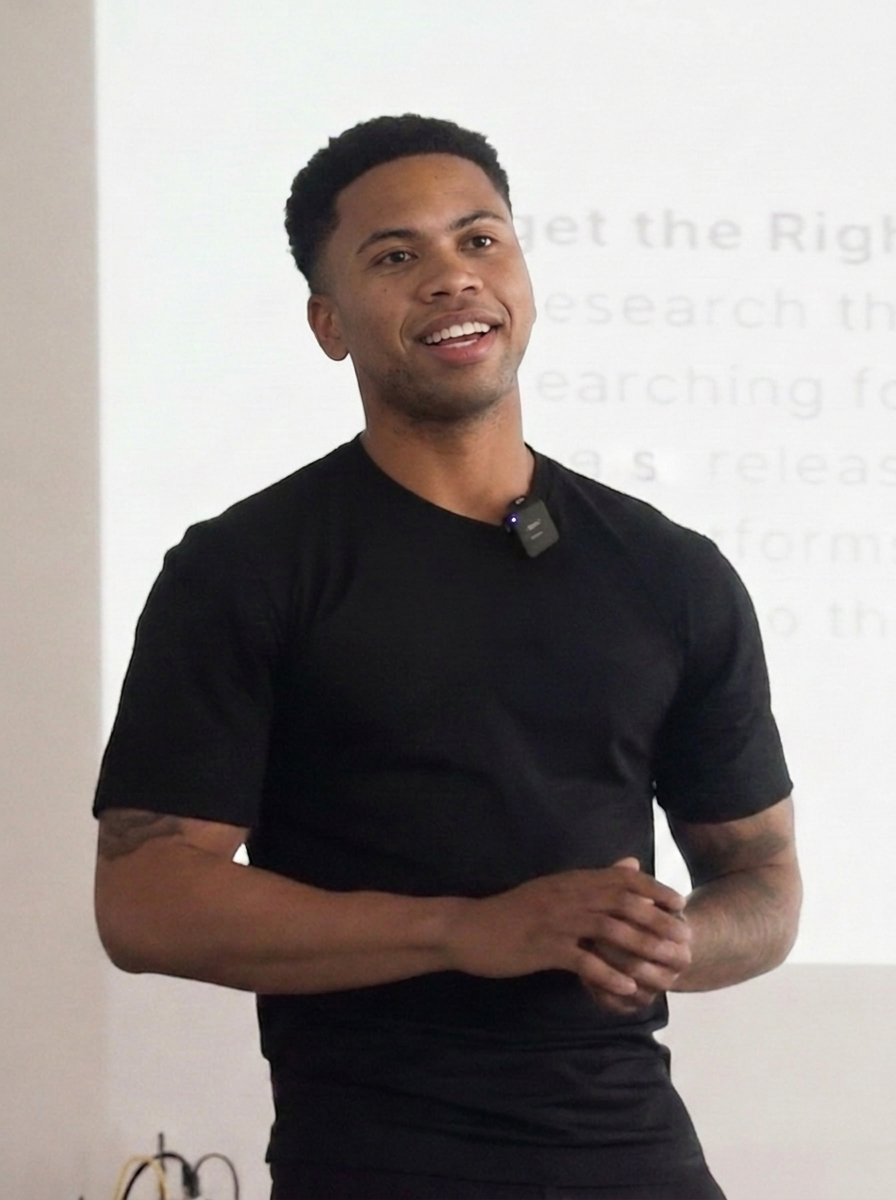 Kaileb Bryant speaking at Sherwin-Williams event